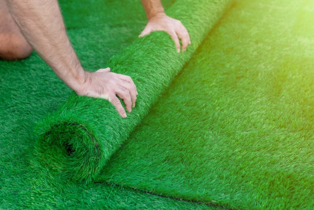 Man Laying Artificial Grass