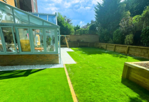 Garden renovation in Weybridge, Surrey, with half artificial grass and half natural turf.
